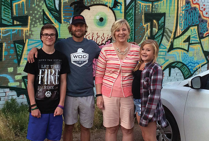 Chad Prichard with his son, Tanner, then 15; his mother, LuAnn Nichols; and his daughter, Madison, 13, outside of Phoenix Multisport in Denver in June 2015.