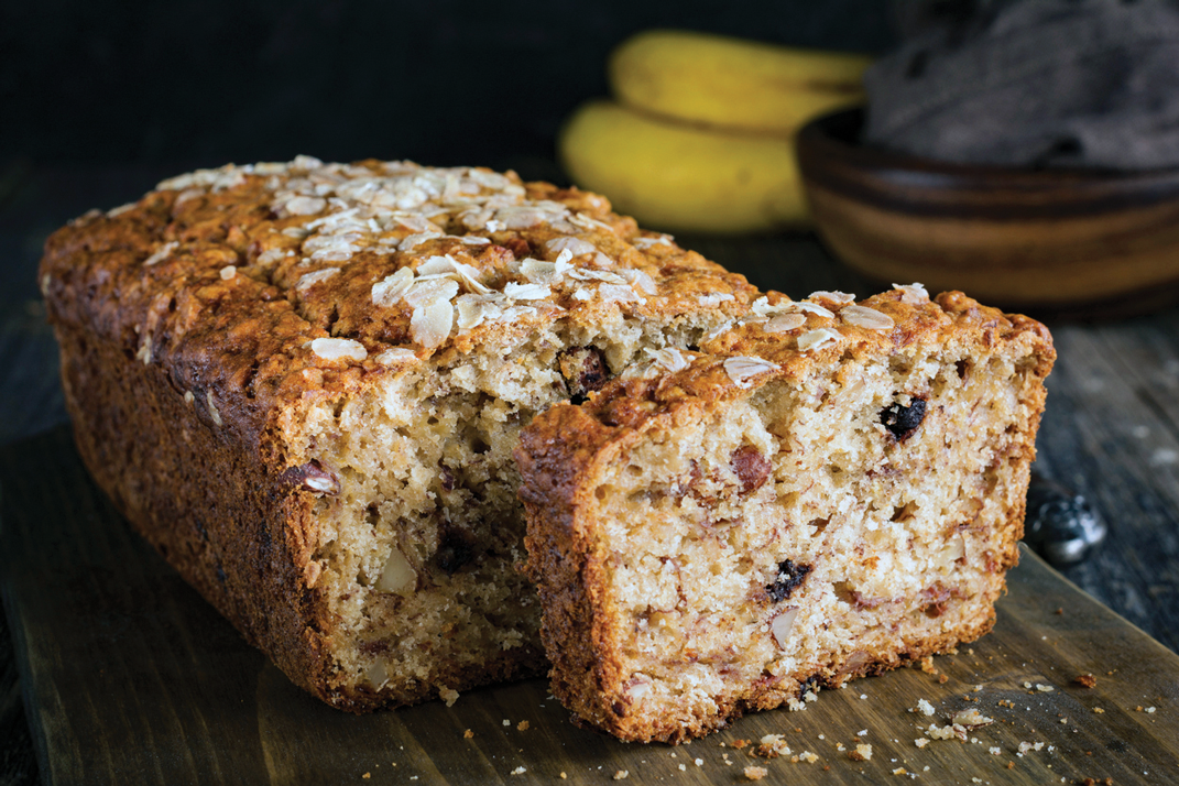 Cut banana bread with crumbs.